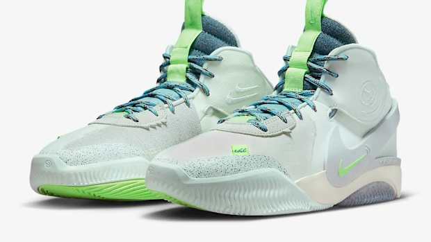 View of green and blue Nike shoes.